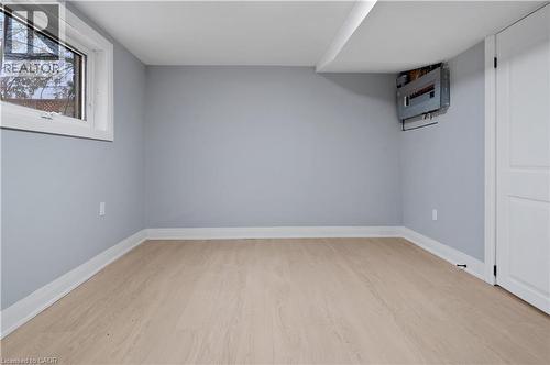 Below grade area featuring light wood-style flooring and baseboards - 19 Broad Street, Brantford, ON - Indoor Photo Showing Other Room