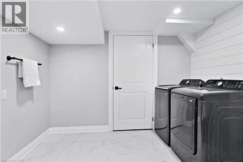Washroom featuring light marble finish flooring, separate washer and dryer, and recessed lighting - 19 Broad Street, Brantford, ON - Indoor Photo Showing Laundry Room