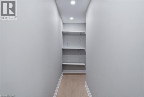 Walk in closet featuring light wood-style flooring - 19 Broad Street, Brantford, ON - Indoor