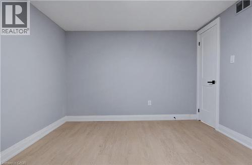 Spare room with light wood-style floors and baseboards - 19 Broad Street, Brantford, ON - Indoor Photo Showing Other Room