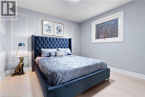 Bedroom featuring baseboards and wood finished floors - 19 Broad Street, Brantford, ON - Indoor Photo Showing Bedroom