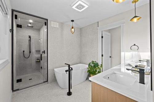 Luxury ensuite with heated floors, double vanity, soaker tub. - 345 Beaverbrook Street, Winnipeg, MB - Indoor Photo Showing Bathroom