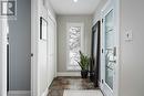 Light-filled, open foyer with tile floors & closet - 19 Trails End, Collingwood, ON 