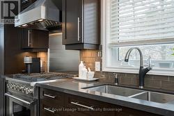 Note the clean, modern aesthetic & glass tile - 