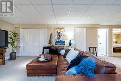 Pot lights, newer carpet & ample storage here - 