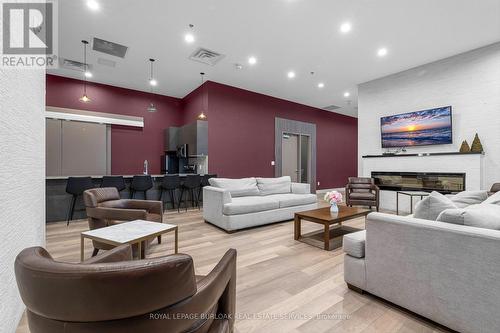 612 - 550 North Service Road N, Grimsby, ON - Indoor Photo Showing Living Room With Fireplace