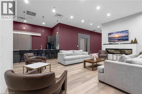 550 North Service Road Unit# 612, Grimsby, ON - Indoor Photo Showing Living Room With Fireplace