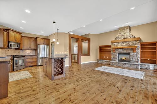 111-1910 Capistrano Drive, Kelowna, BC - Indoor Photo Showing Other Room With Fireplace
