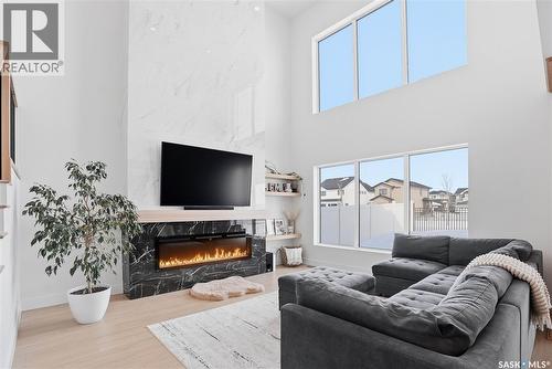 139 Woolf Bend, Saskatoon, SK - Indoor Photo Showing Living Room With Fireplace