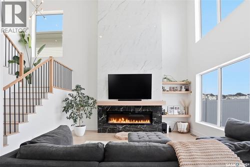 139 Woolf Bend, Saskatoon, SK - Indoor Photo Showing Living Room With Fireplace