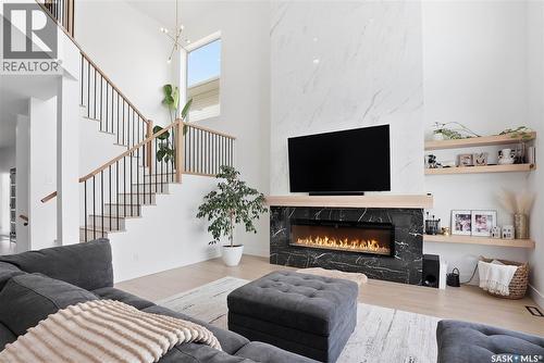 139 Woolf Bend, Saskatoon, SK - Indoor Photo Showing Living Room With Fireplace