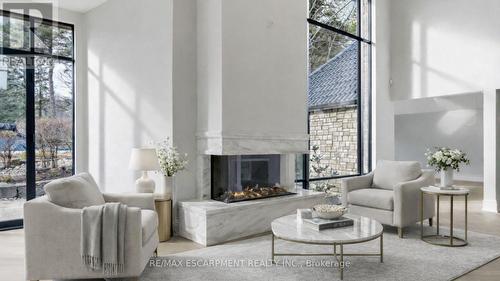 Virtually Staged - 3320 Guelph Line, Burlington, ON - Indoor Photo Showing Living Room With Fireplace