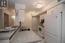 404 - 4 Elsinore Path, Toronto, ON  - Indoor Photo Showing Kitchen 