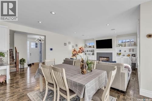 438 Horlick Manor, Saskatoon, SK - Indoor Photo Showing Dining Room With Fireplace