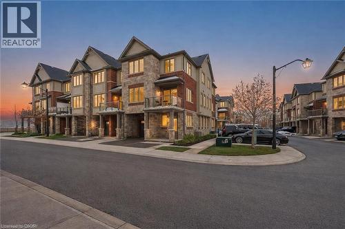 View of property at dusk - 4 Andruss Lane, Ancaster, ON - Outdoor With Facade
