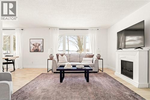 5749 Second Line E, Ariss, ON - Indoor Photo Showing Living Room With Fireplace
