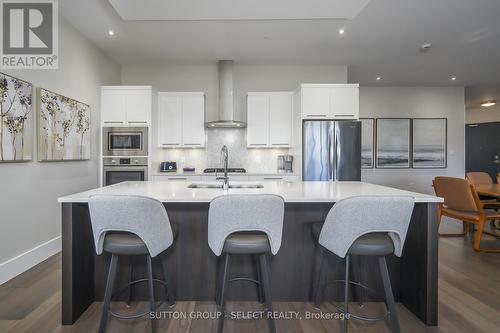 107 - 1705 Fiddlehead Place, London North (North R), ON - Indoor Photo Showing Kitchen With Stainless Steel Kitchen With Upgraded Kitchen