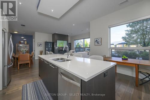 107 - 1705 Fiddlehead Place, London North (North R), ON - Indoor Photo Showing Kitchen With Double Sink