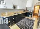 424 6Th Avenue Nw, Swift Current, SK  - Indoor Photo Showing Kitchen With Double Sink 