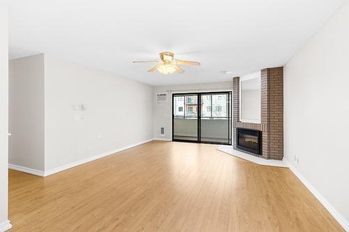 304-1490B Gordon Drive, Kelowna, BC - Indoor With Fireplace