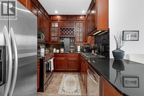 1225 Riverside Drive Unit# 404, Windsor, ON - Indoor Photo Showing Kitchen With Double Sink