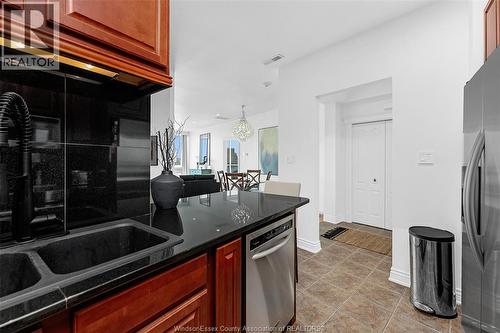 1225 Riverside Drive Unit# 404, Windsor, ON - Indoor Photo Showing Kitchen With Double Sink