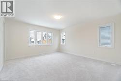 Unfurnished room with light colored carpet - 