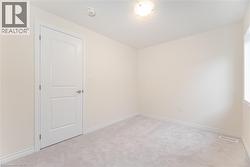Spare room with light carpet - 