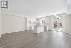 Unfurnished living room featuring light hardwood / wood-style flooring - 