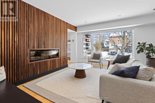 Living room with wood feature wall - 330 Winona Avenue, Ottawa, ON - Indoor Photo Showing Living Room With Fireplace