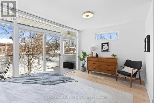 Primary bedrm w-expansive windows & patio walkout - 330 Winona Avenue, Ottawa, ON - Indoor Photo Showing Bedroom