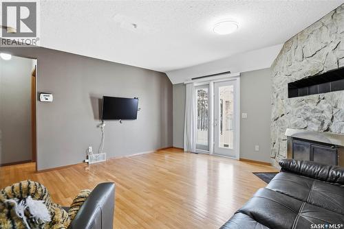 542 Kellough Road, Saskatoon, SK - Indoor Photo Showing Living Room With Fireplace