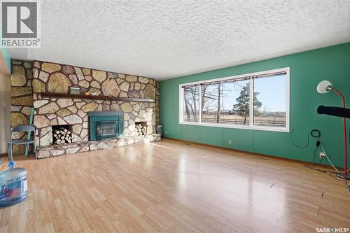 Chamberlain Acreage, Chamberlain, SK - Indoor Photo Showing Living Room With Fireplace