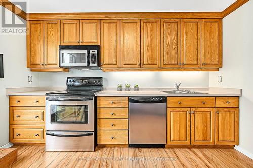 Ample Cabinets and Under Cabinet Lighting - 401 - 337 Simcoe Street, Oshawa (O'Neill), ON - Indoor Photo Showing Kitchen With Double Sink