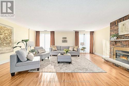 401 - 337 Simcoe Street, Oshawa (O'Neill), ON - Indoor Photo Showing Living Room With Fireplace
