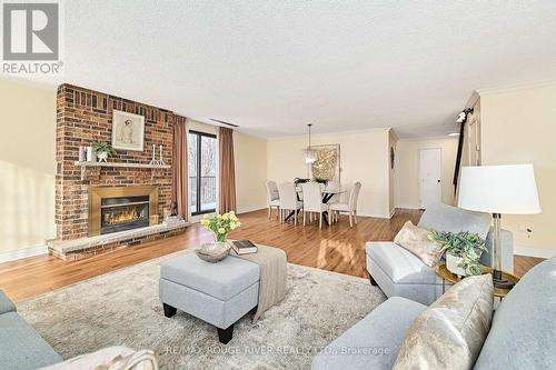401 - 337 Simcoe Street, Oshawa (O'Neill), ON - Indoor Photo Showing Living Room With Fireplace
