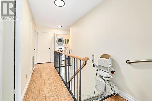 Convenient Stair Lift to accomodate Access - 401 - 337 Simcoe Street, Oshawa (O'Neill), ON - Indoor Photo Showing Other Room