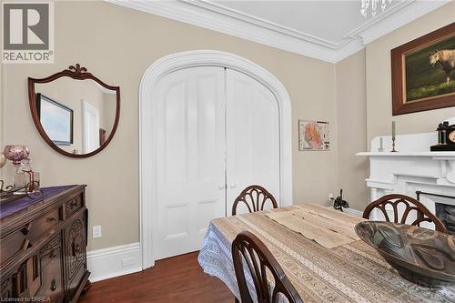 Dining room featuring dark hardwood / wood-style floors and crown molding - 40 Locke Street S, Hamilton, ON - Indoor