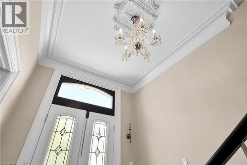 Foyer featuring french doors, a chandelier, and ornamental molding - 40 Locke Street S, Hamilton, ON - Indoor Photo Showing Other Room