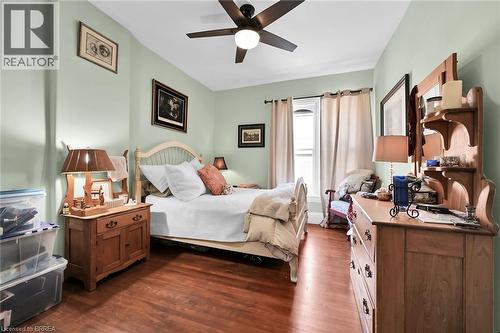 Bedroom with ceiling fan and dark hardwood / wood-style floors - 40 Locke Street S, Hamilton, ON - Indoor Photo Showing Bedroom