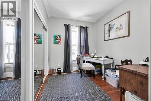 Office area featuring dark wood-type flooring and plenty of natural light - 40 Locke Street S, Hamilton, ON - Indoor Photo Showing Office