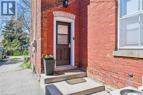 Property entrance featuring central air condition unit - 40 Locke Street S, Hamilton, ON - Outdoor With Exterior