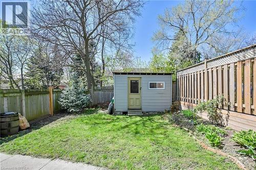 View of outdoor structure featuring a lawn - 40 Locke Street S, Hamilton, ON - Outdoor