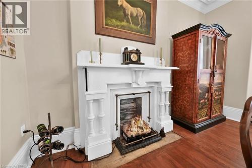 Room details with crown molding and hardwood / wood-style floors - 40 Locke Street S, Hamilton, ON - Indoor With Fireplace