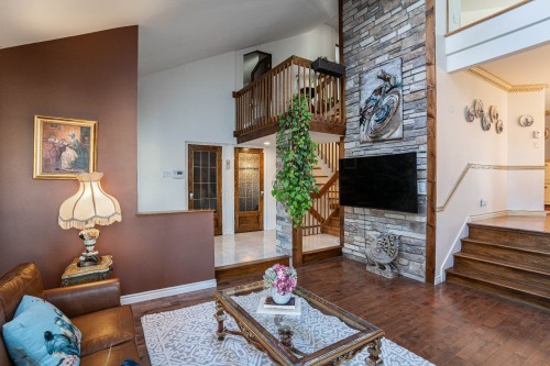 Salon - 8940 Boul. Marie-Victorin, Brossard, QC - Indoor Photo Showing Living Room With Fireplace