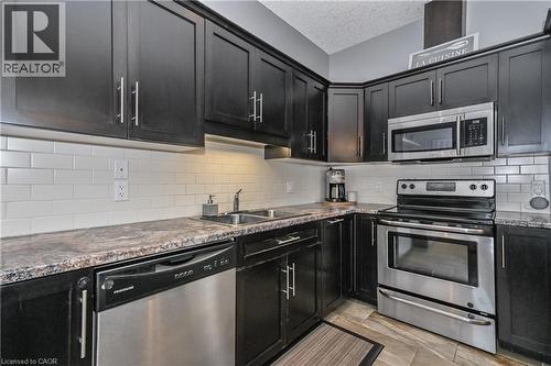 557 Landgren Court Unit# A, Kitchener, ON - Indoor Photo Showing Kitchen With Double Sink With Upgraded Kitchen