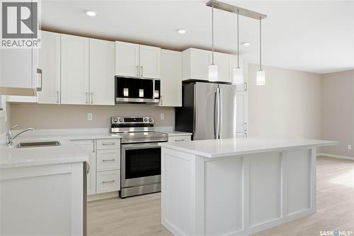 42 Aitken Crescent, Regina, SK - Indoor Photo Showing Kitchen With Stainless Steel Kitchen With Upgraded Kitchen
