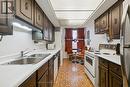 1801 - 1300 Bloor Street, Mississauga, ON  - Indoor Photo Showing Kitchen With Double Sink 