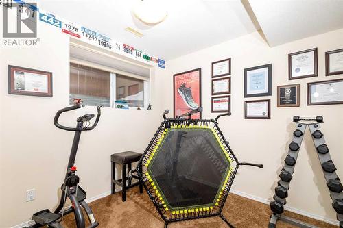 37 Regatta Way, Sylvan Lake, AB - Indoor Photo Showing Gym Room