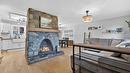 7312 Fintry Delta Road, Kelowna, BC  - Indoor Photo Showing Living Room With Fireplace 